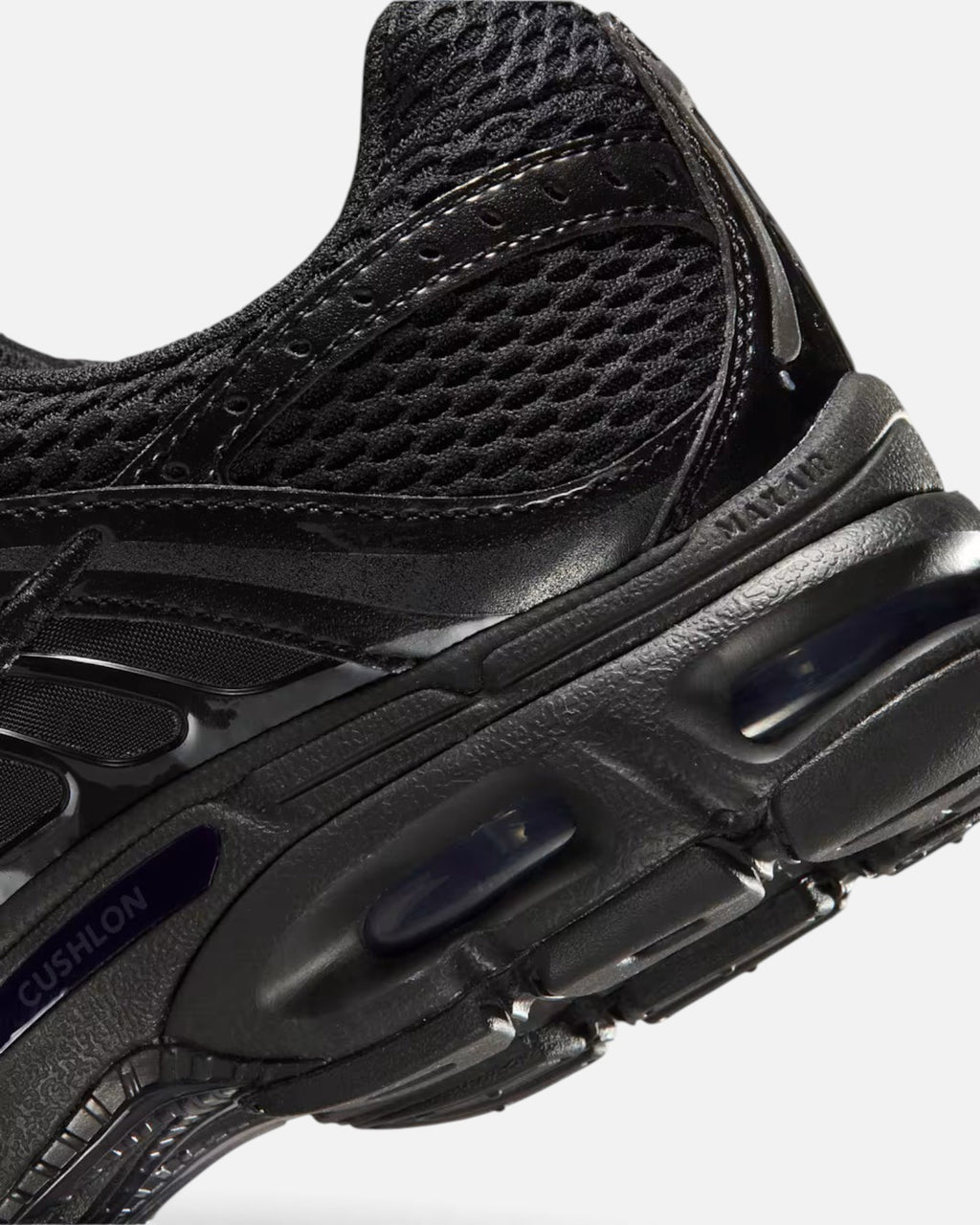 CRIUW NIKE AIR MAX MOTO 2K black sneaker showing mesh upper, metallic details, and Max Air cushioning unit.