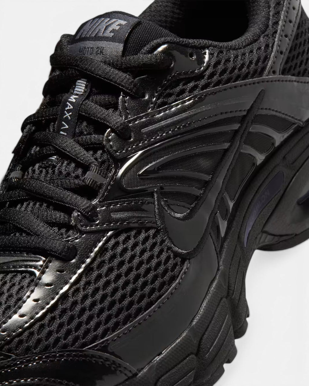 CRIUW Nike Air Max Moto 2K black performance sneaker with mesh upper and metallic detailing