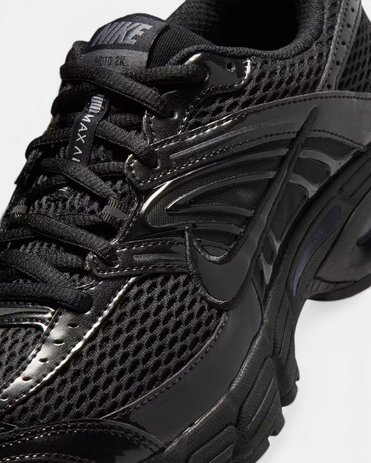CRIUW Nike Air Max Moto 2K black performance sneaker with mesh upper and metallic detailing