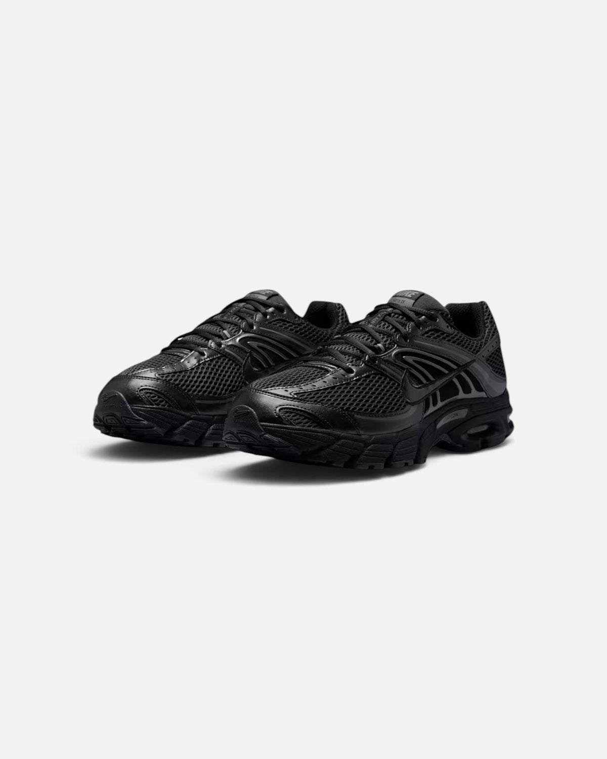 CRIUW Nike Air Max Moto 2K sneakers in all-black with metallic accents, mesh upper, and performance cushioning.
