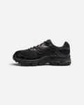 CRIUW Nike Air Max Moto 2K sneakers in all black with metallic accents and mesh detailing, side view.