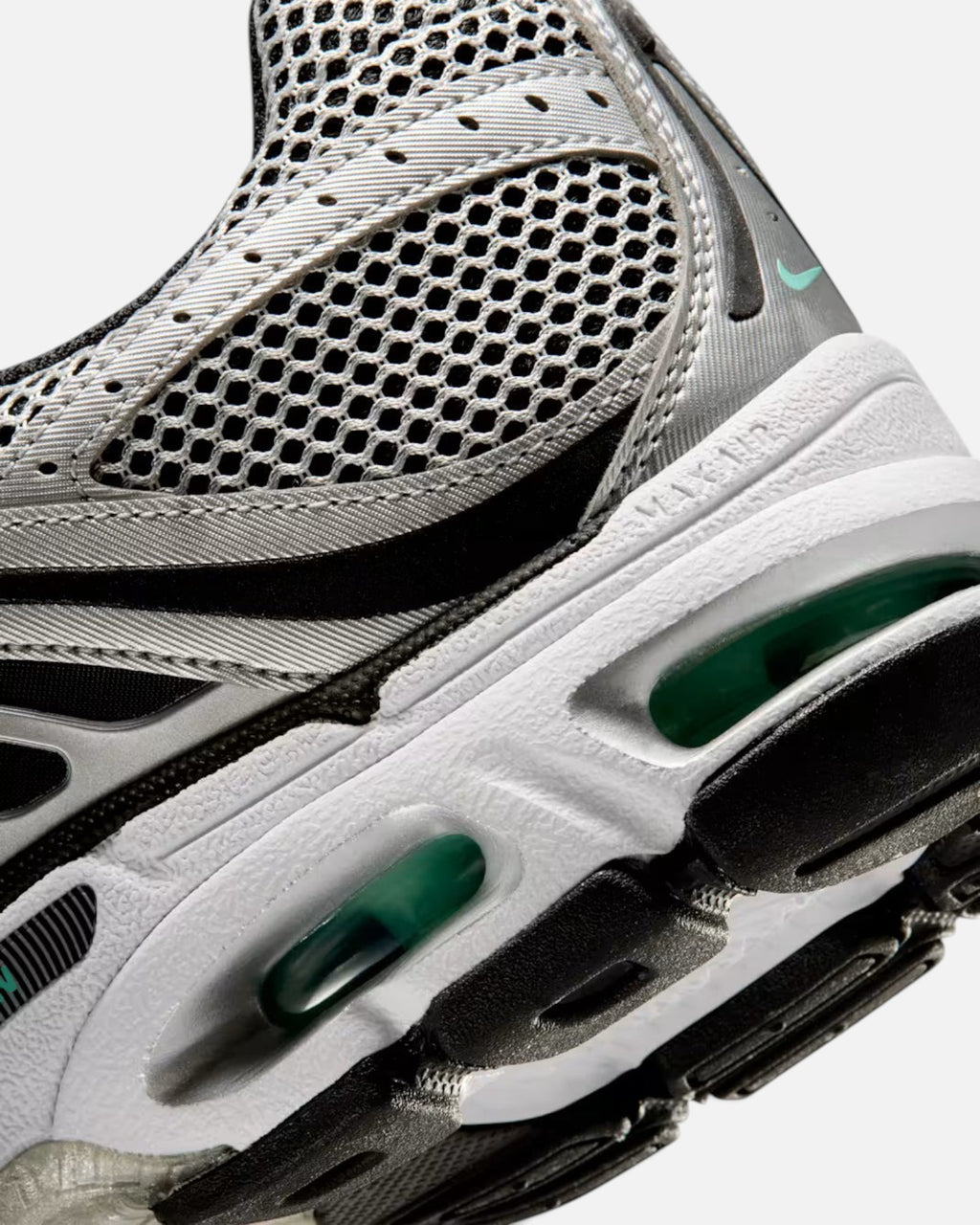 CRIUW Nike Air Max Moto 2K sneaker featuring metallic silver mesh, black accents, and green Max Air cushioning unit.