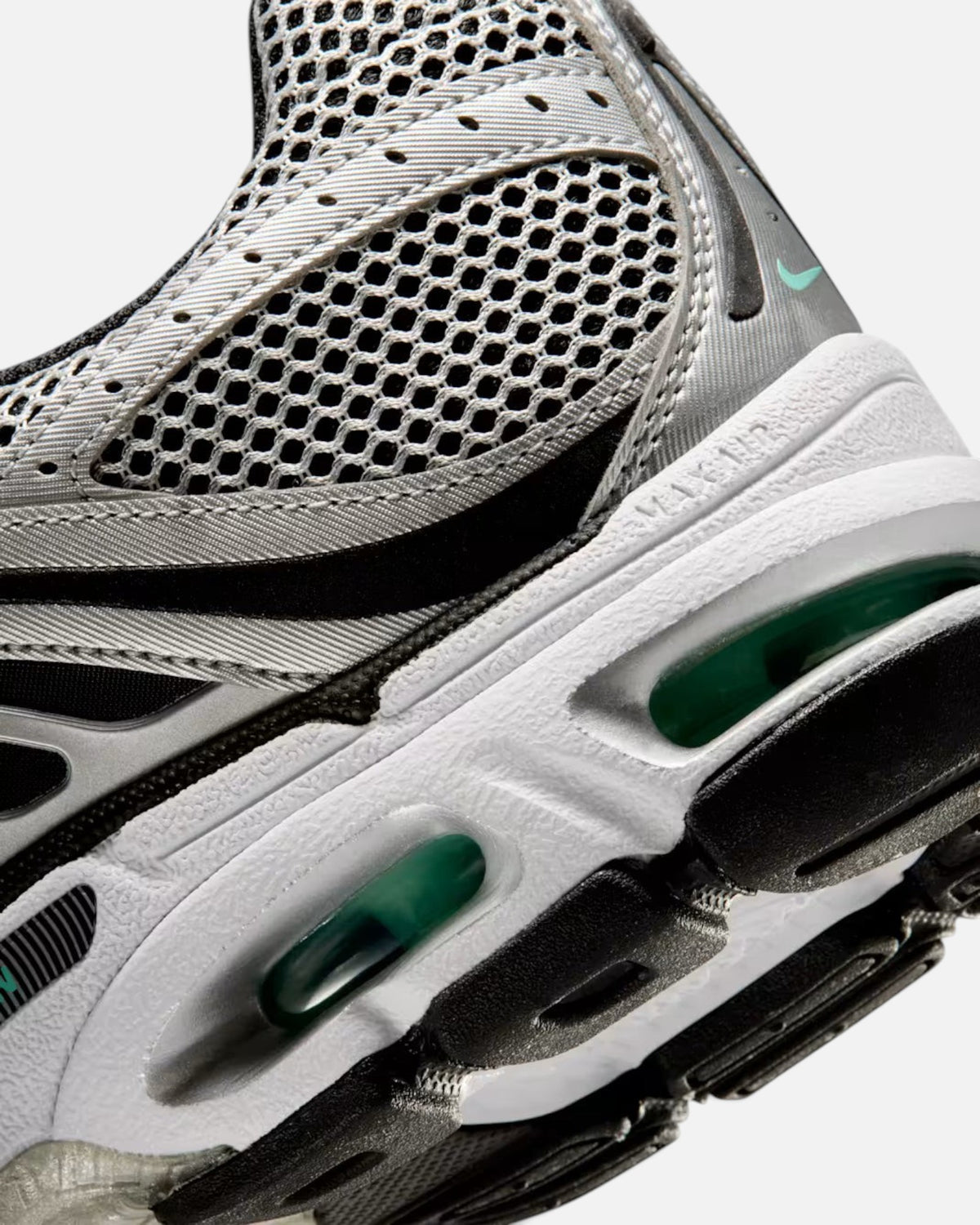 CRIUW Nike Air Max Moto 2K sneaker featuring metallic silver mesh, black accents, and green Max Air cushioning unit.