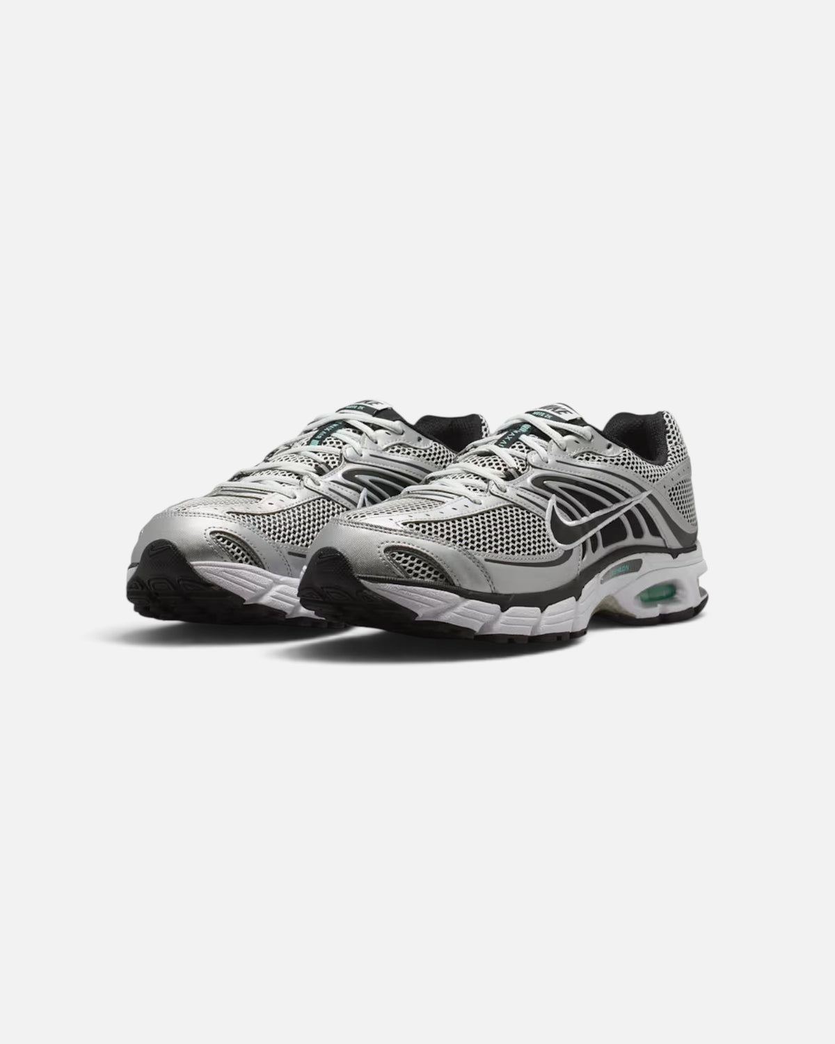CRIUW Nike Air Max Moto 2K sneakers in off-white and metallic silver with mesh panels and performance cushioning.