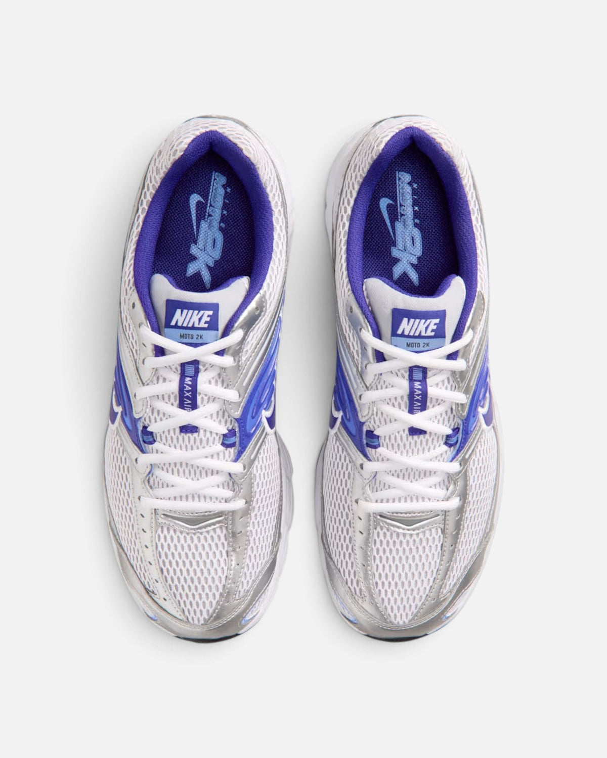 CRIUW NIKE Air Max Moto 2K sneakers in white, silver, and royal pulse with mesh upper and performance cushioning.