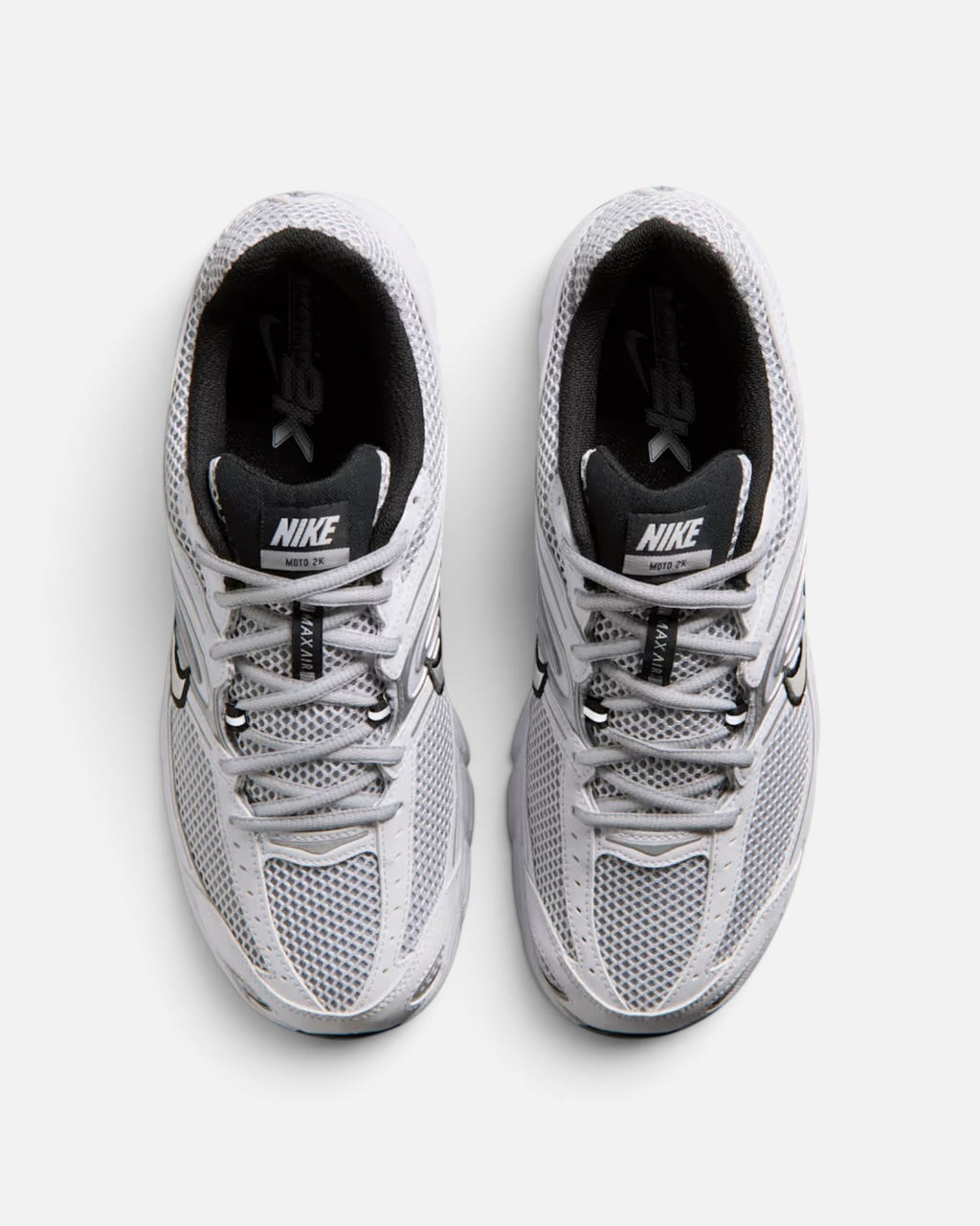CRIUW Nike Air Max Moto 2K white performance sneakers with metallic details and breathable mesh upper, top view.