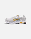 CRIUW Nike Air Max Moto 2K sneakers in wolf grey with yellow accents and metallic details on a white background