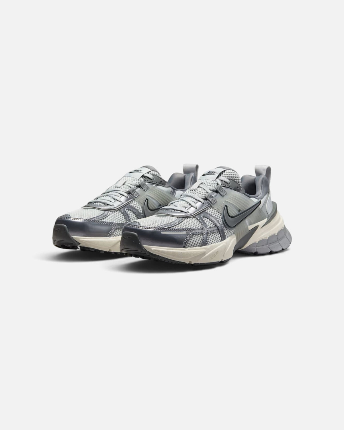 CRIUW Nike V2K Run sneakers in metallic cool grey with mesh upper, plastic overlays, and chunky vintage midsole.