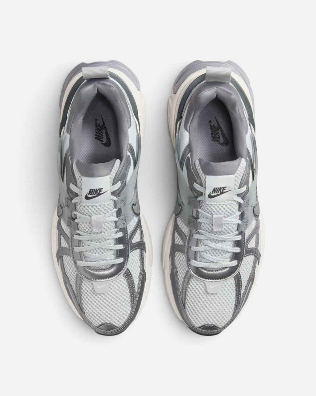 CRIUW NIKE V2K Run sneakers in metallic cool grey with mesh upper and vintage-inspired chunky sole, top view.