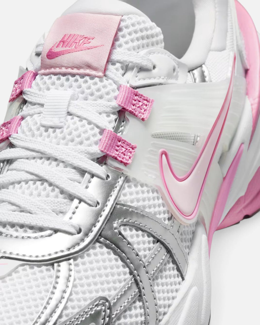 CRIUW NIKE V2K Run sneakers in white mesh with metallic silver overlays and pink foam accents on a chunky sole.