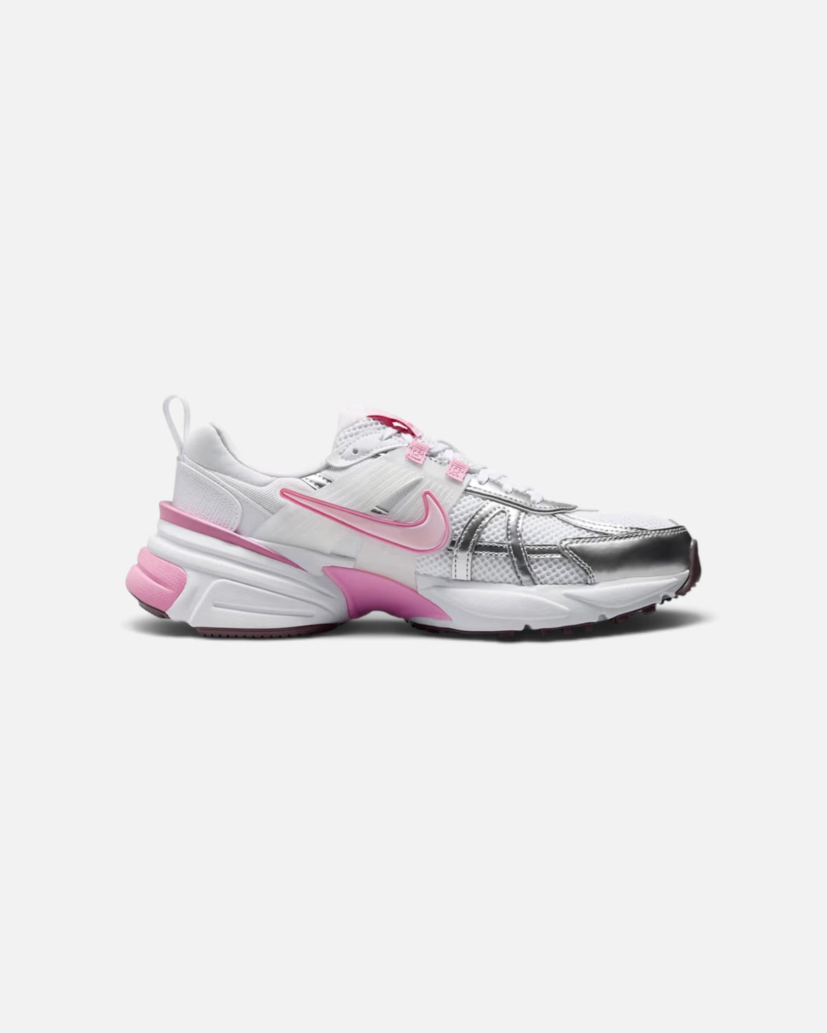 CRIUW Nike V2K Run sneakers in white and pink foam with metallic silver accents and a chunky retro-inspired sole.