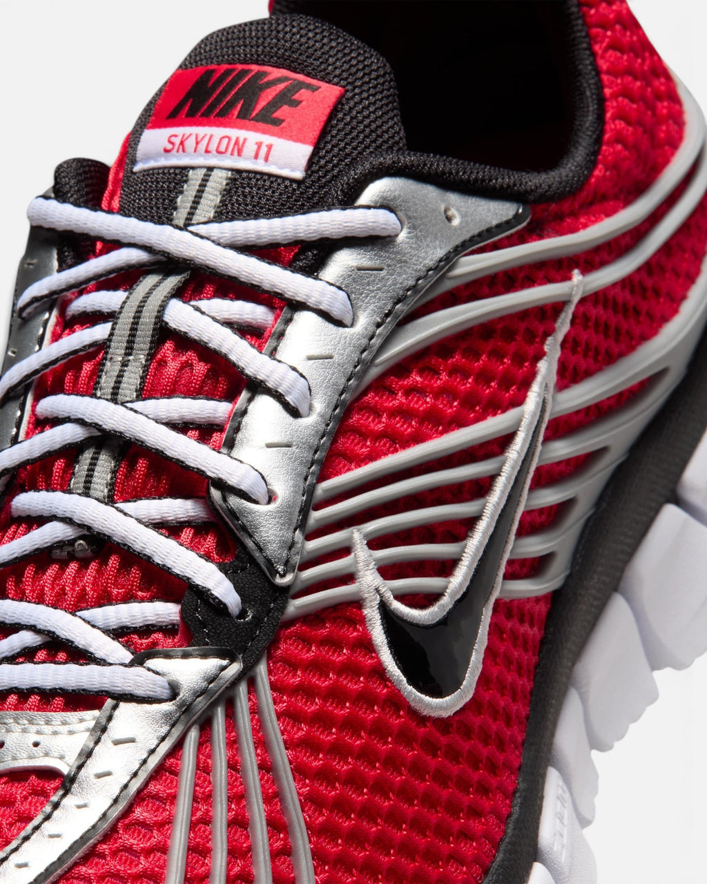 CRIUW NIKE Zoom Skylon 11 running shoe in university red mesh with metallic silver accents and black details