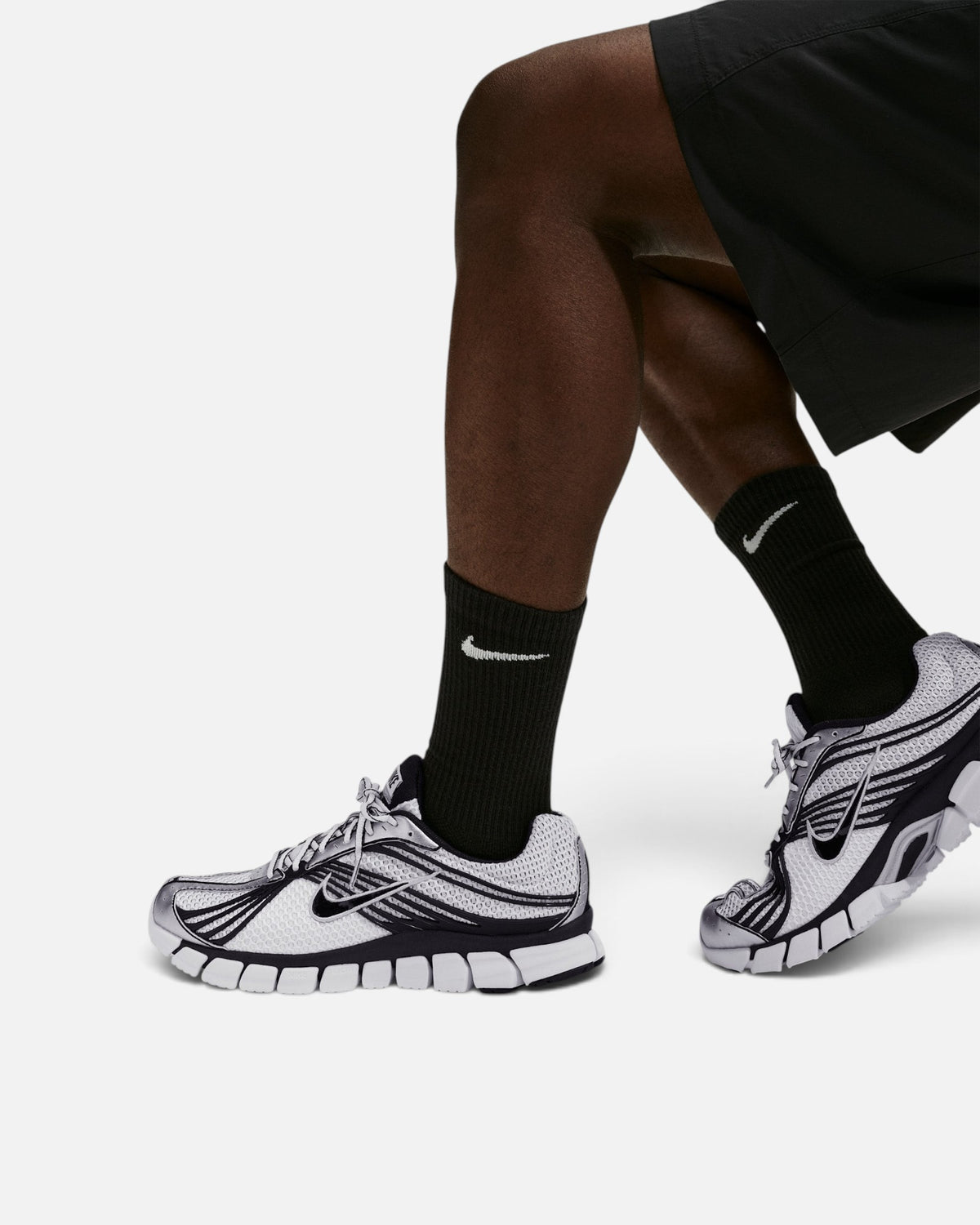CRIUW Nike Zoom Skylon 11 Summit White sneakers with breathable mesh, black accents, and metallic silver detailing.