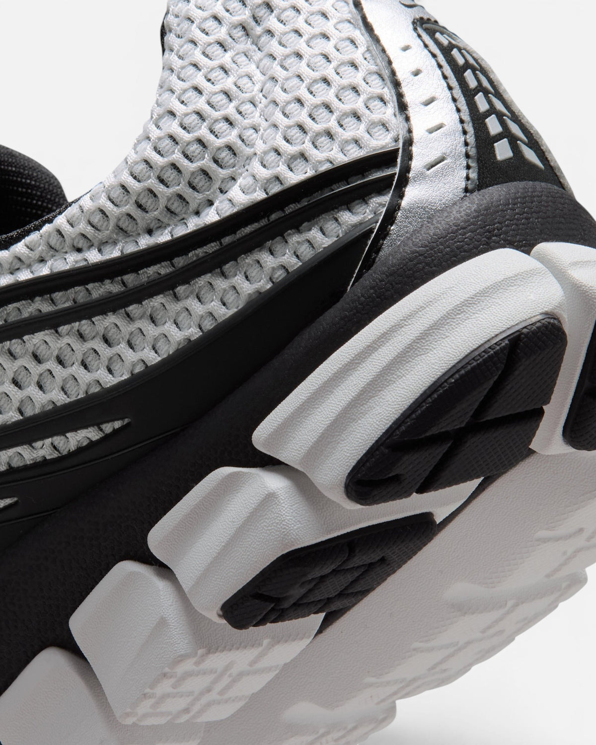 CRIUW Nike Zoom Skylon 11 sneaker in summit white with breathable mesh, metallic silver accents, and black detailing.