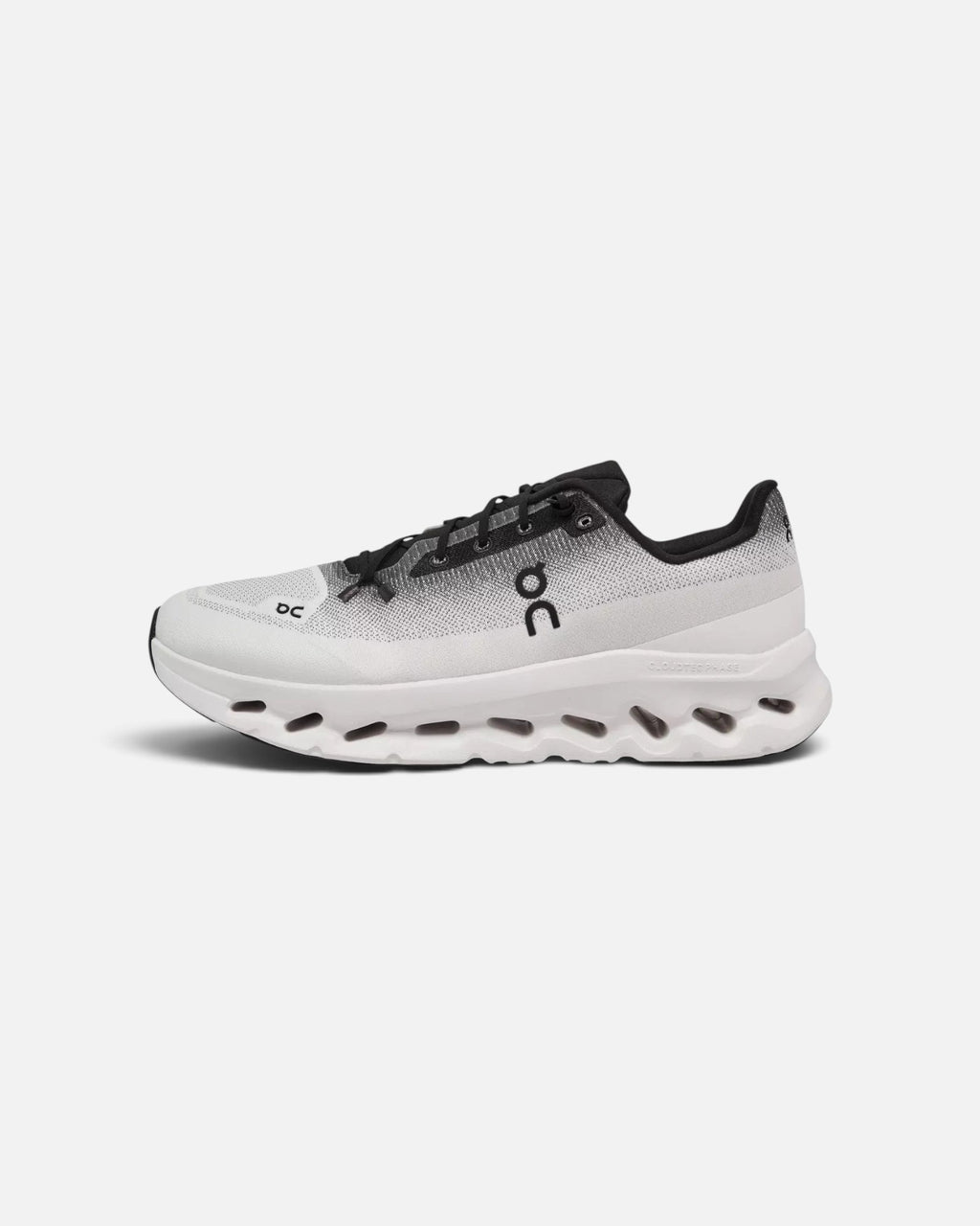 CRIUW On Cloudtilt sneakers in black and ivory with a lightweight mesh upper and cushioned CloudTec sole