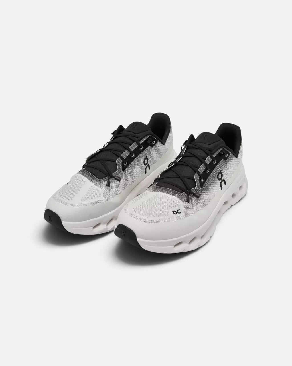 CRIUW On Cloudtilt sneakers in black and ivory with a lightweight mesh upper and cushioned performance sole