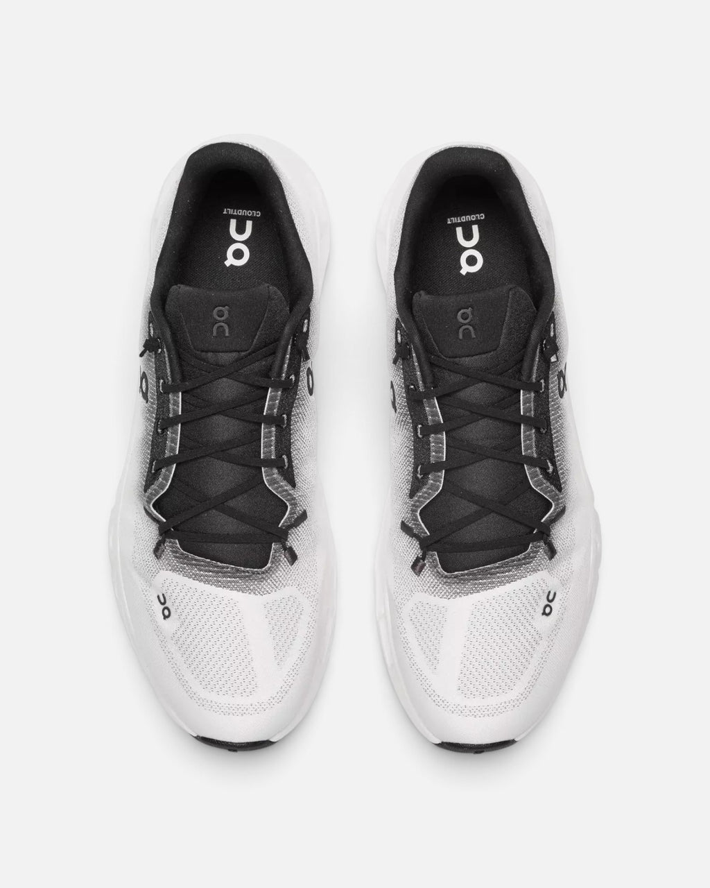 CRIUW On Cloudtilt sneakers in black and ivory featuring a lightweight mesh upper and modern performance design.