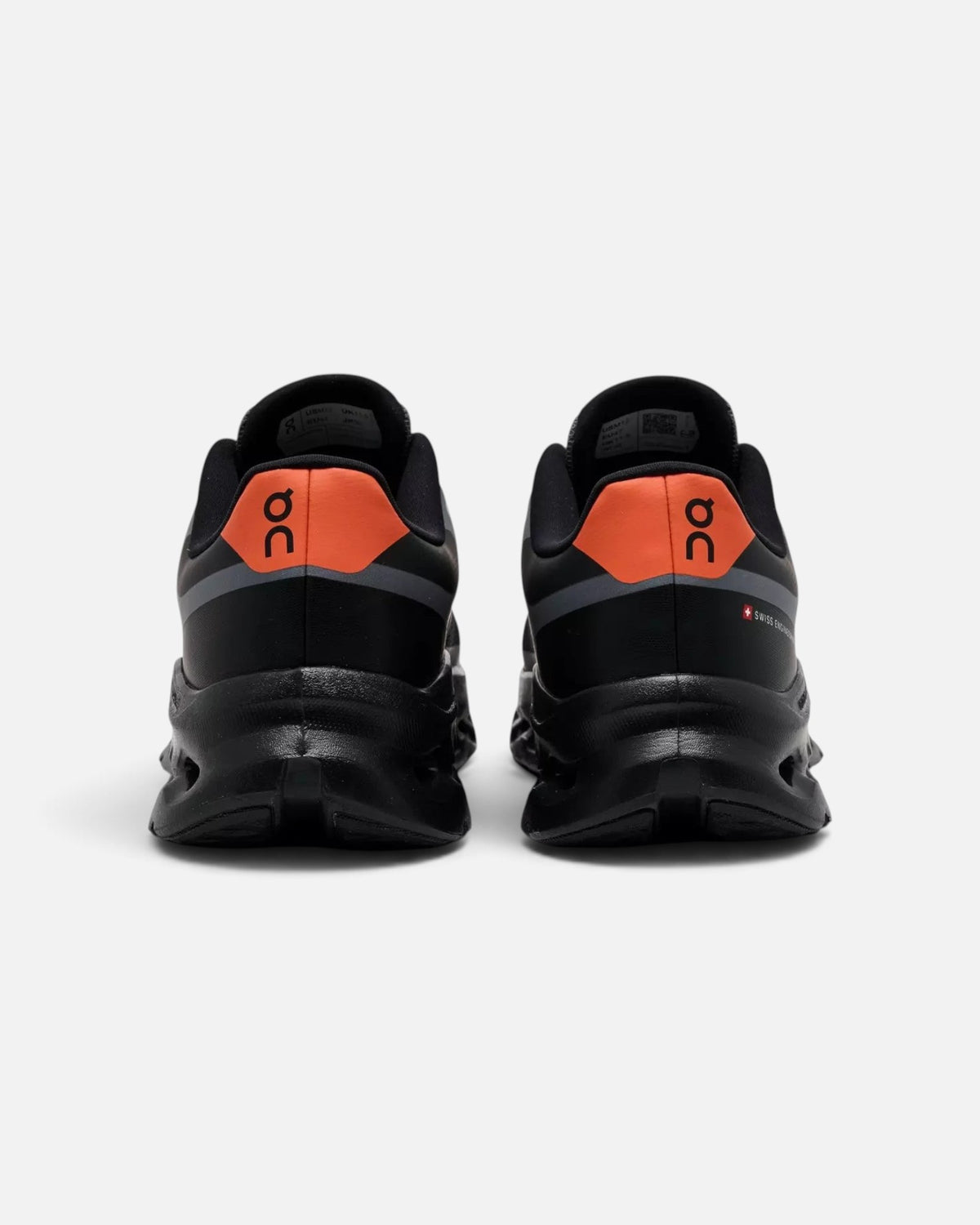 CRIUW On Cloudtilt Remix sneakers in black with flame orange heel detail, showing rear view of mesh upper.