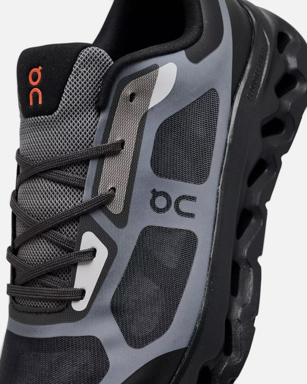 CRIUW On Cloudtilt Remix sneakers in black and grey with mesh upper, transparent overlays, and CloudTec cushioning.